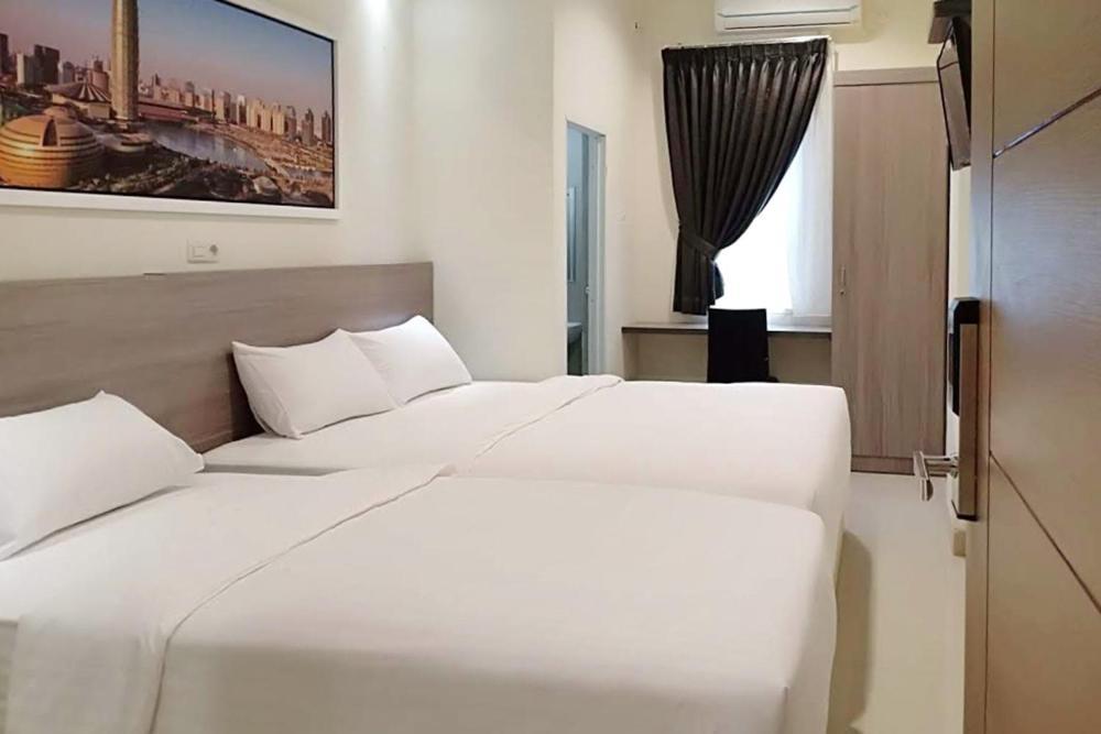 Twospaces Living At Maximus Inn Palembang Exteriör bild