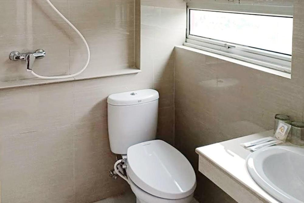 Twospaces Living At Maximus Inn Palembang Exteriör bild